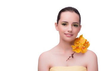 Young woman with orchid flower isolated on white