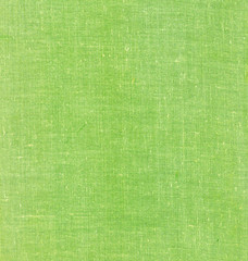 Green textile book cover surface.