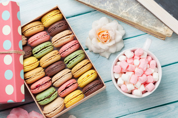 Colorful macaroons in a box and marshmallow