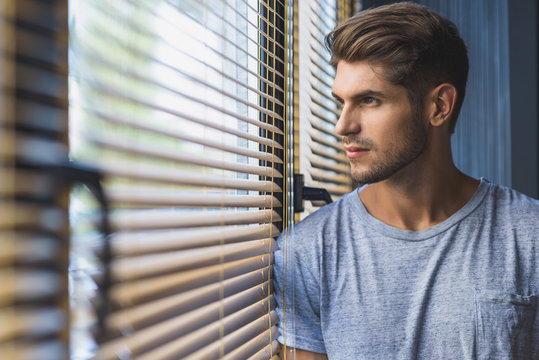 man daydreaming at work - Powered by Adobe