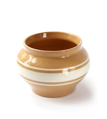 Glazed ceramic pot for cooking on a white background