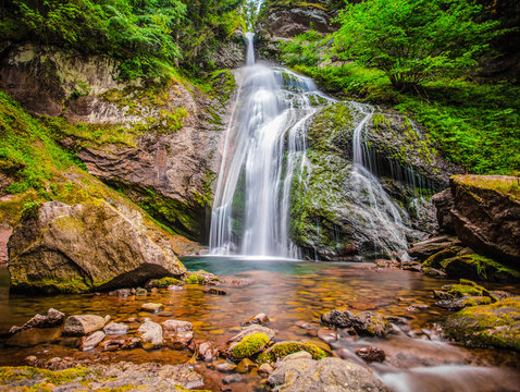 Fototapeta Waterfall of Cavalese,Val di Fiemme, Trentino, Dolomites, Trento, Italy