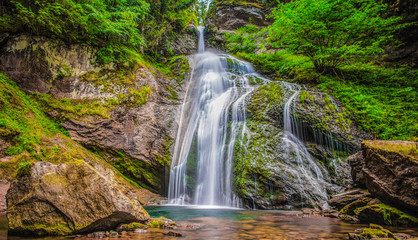 Fototapeta premium Waterfall of Cavalese,Val di Fiemme, Trentino, Dolomites, Trento, Italy