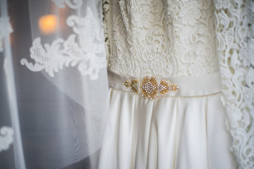 White Wedding dress on a shoulders, before ceremony