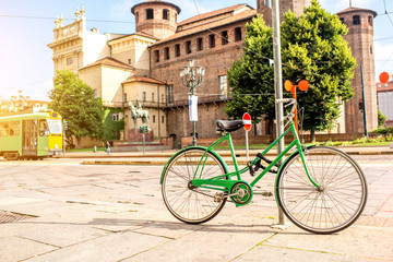 Green bicycle near Madama castle in the old city center of Turin in Piedmont region in Italy
