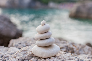 Balance stone on sea coast. Zen rocks on the beach
