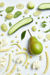 still life of fresh green vegetables and fruits