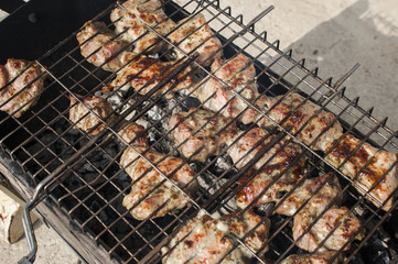 barbecue cooked on the grate of the grill