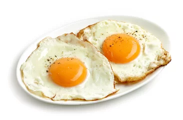 Wall murals Fried eggs fried eggs on white background