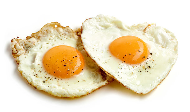 fried eggs on white background