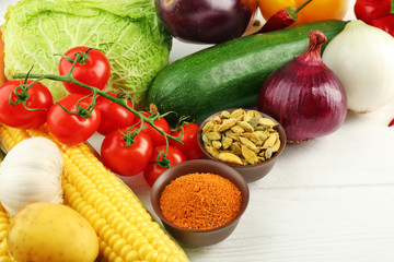 Vegetables and spices on wooden table