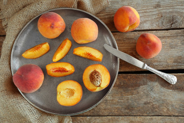 Fresh peaches on a wooden background