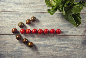 Healthy Organic Vegetables Tomatoes on a Wooden Background. Art