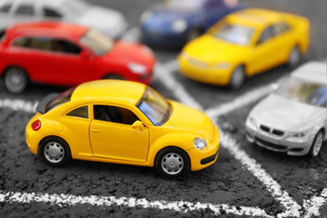Fototapeta na wymiar Close up of toy cars parking