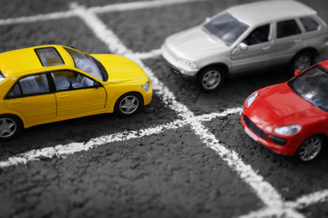 Fototapeta na wymiar Close up of toy cars parking