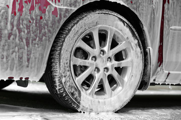 Fototapeta na wymiar Car washing concept. Car in foam