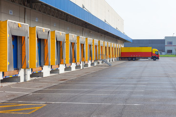 A Large distribution warehouse with gates for loading goods