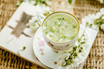 Acacia tea brewed in a cup is on the table