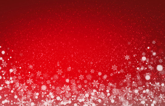 Soft lights and snow on christmas red background