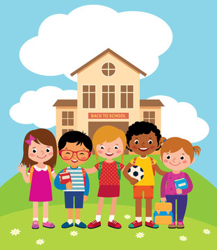 Group Of Happy Children Standing In Front Of The School Building