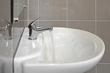 ceramic washbasin and metal faucet