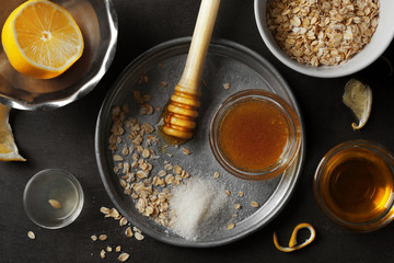 Natural scrub ingredients on gray background