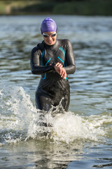 Sportive girl runs on the water