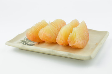 pomelo on rectangle dish isolated