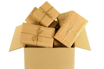 Cardboard shipping delivery box with several lots small brown paper wrapped package parcel inside open opening photo isolated on white background