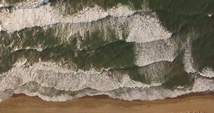 Aerial video of waves on beach near Rethymno, Crete, Greece