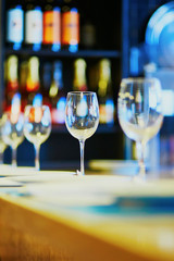 Row of wine glasses on the table in restaurant