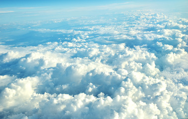 Fototapeta na wymiar clouds view from the window of an airplane flying in the clouds