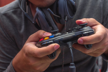 Focused young gamer playing games using his controller.