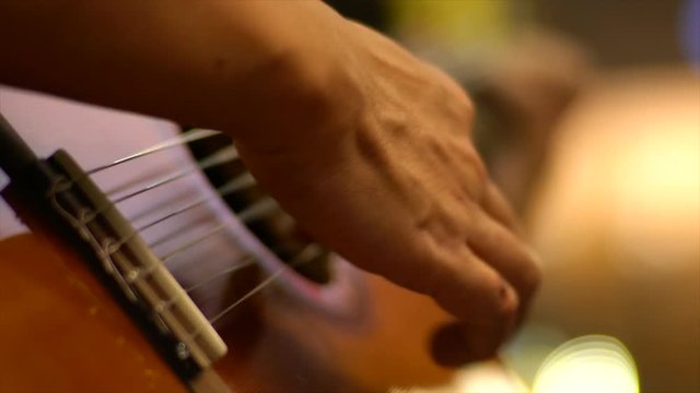 Musician Playing On Classical Guitar.