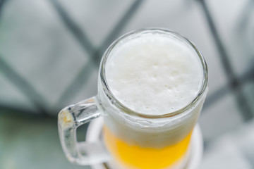 Mug with beer on table .