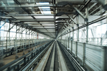 Fototapeta premium Picture inside a commuter train in Tokyo aproaching the end of Odaiba's Rainbow bridge.