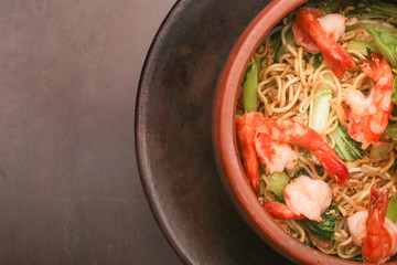 Top view of bowl of noodle with shrimps
