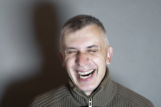 Man Bursting Into Laugh