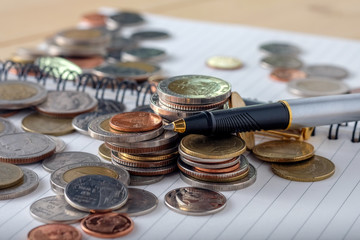 business finance. save money for investment concept coins and pe