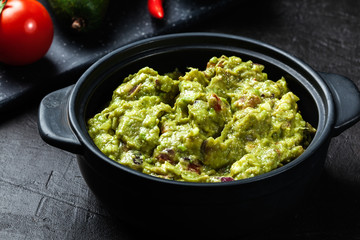 Bowl of guacamole with fresh ingredients