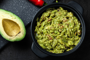 Bowl of guacamole with fresh ingredients