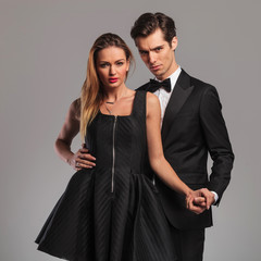 embraced elegant couple holding hands