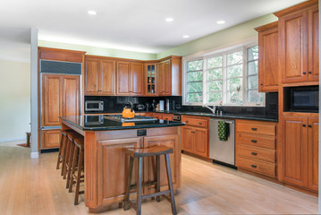 Modern wooden kitchen in dark wood.