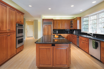 Modern wooden kitchen in dark wood.