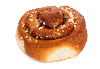 Swedish cinnamon roll on white. Selective focus.