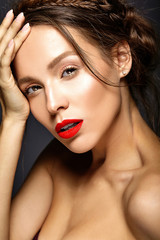 portrait of beautiful woman model with fresh daily makeup and red lips and healthy skin