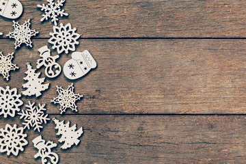 Wood christmas decoration on wood background with copyspace.