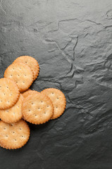 cracker stacked on black granite
