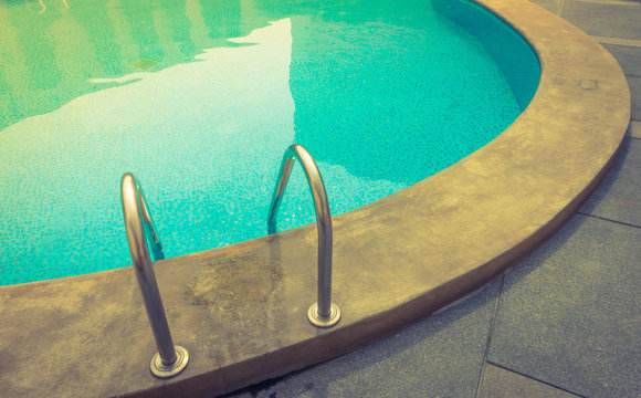 Swimming pool with stairs . ( Filtered image processed vintage e