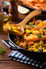 Traditional Spanish paella with seafood and chicken.